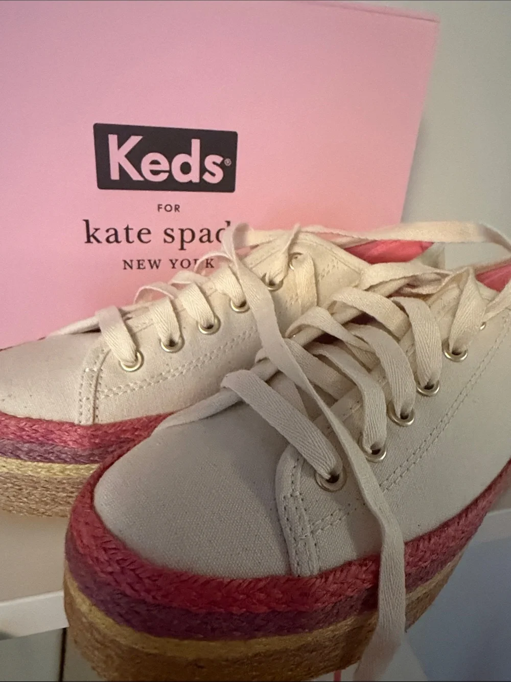 kate spade cream canvas platform sneakers with pink and gold accents
